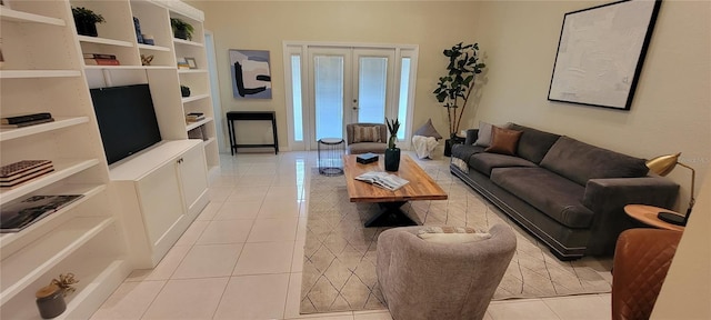 living room with french doors and light tile patterned flooring