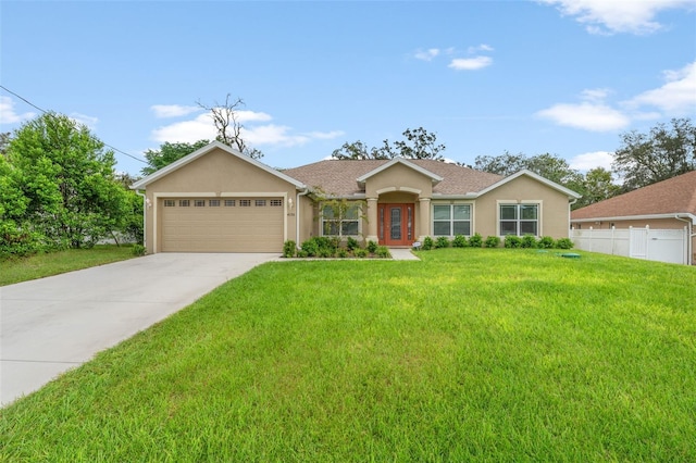 ranch-style home featuring a garage and a front lawn