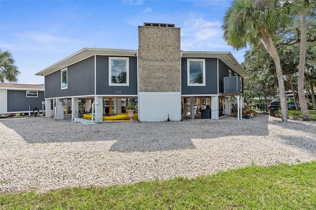 rear view of property featuring a patio area