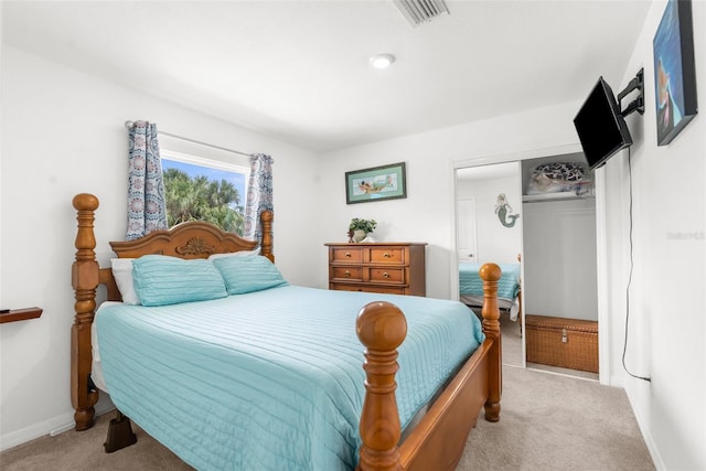 carpeted bedroom featuring a closet