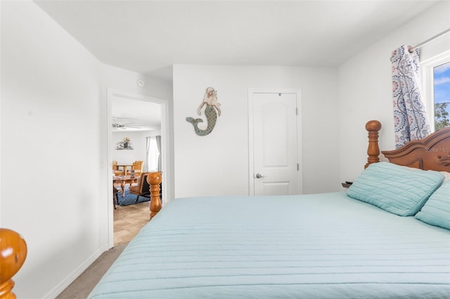 bedroom featuring light carpet