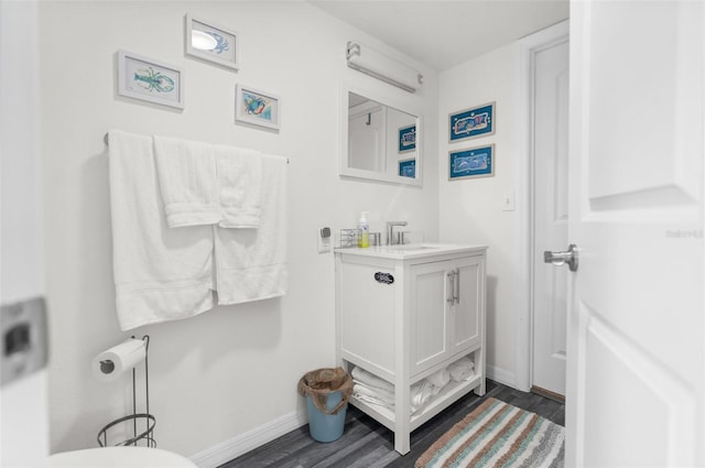 bathroom with vanity and hardwood / wood-style floors