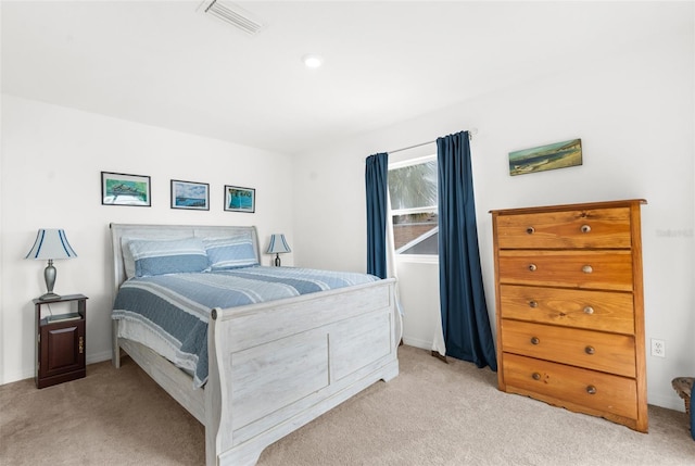 bedroom featuring light colored carpet