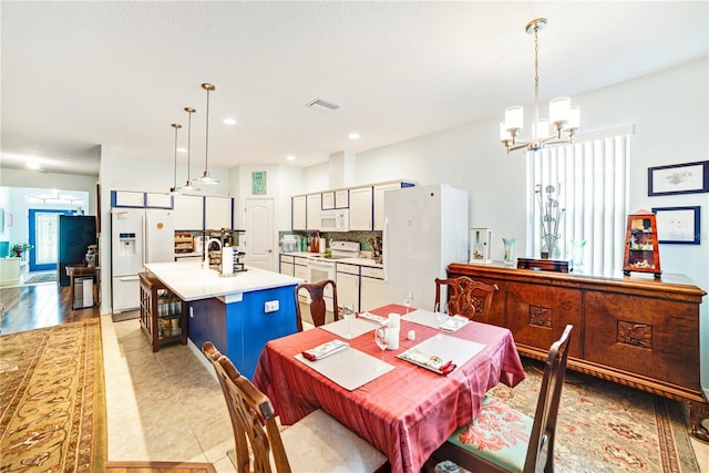 dining area featuring a chandelier