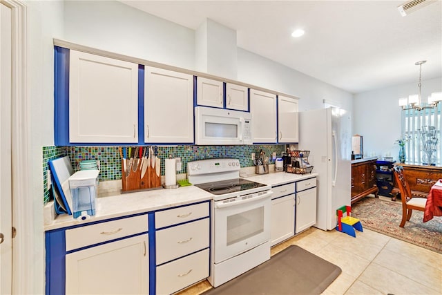 kitchen with tasteful backsplash, a chandelier, pendant lighting, white appliances, and light tile patterned flooring