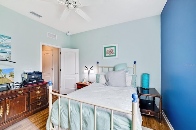 bedroom with ceiling fan and light hardwood / wood-style floors