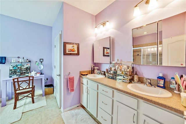 bathroom featuring vanity and a shower with door