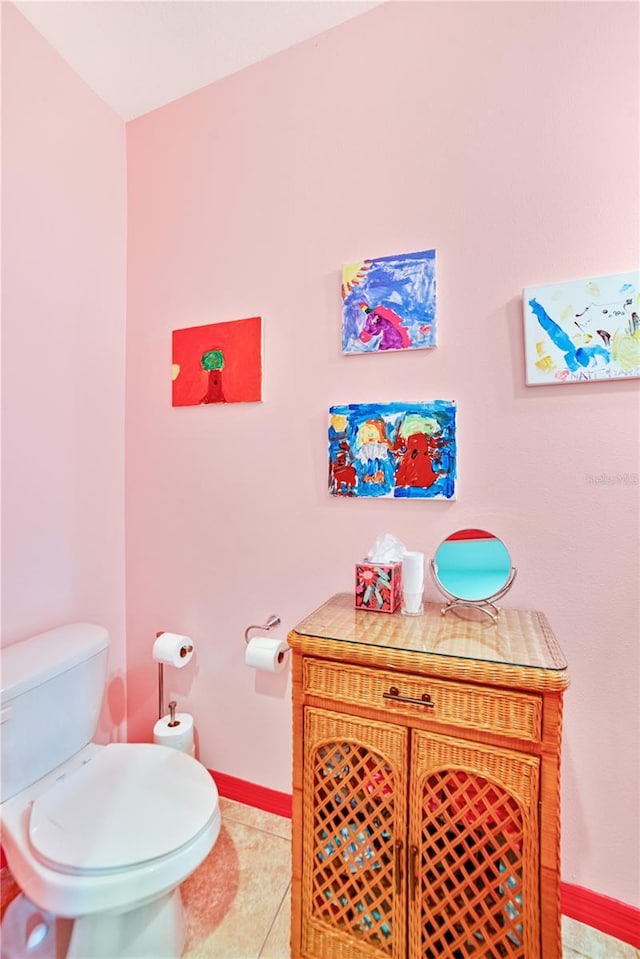 bathroom with tile patterned flooring and toilet