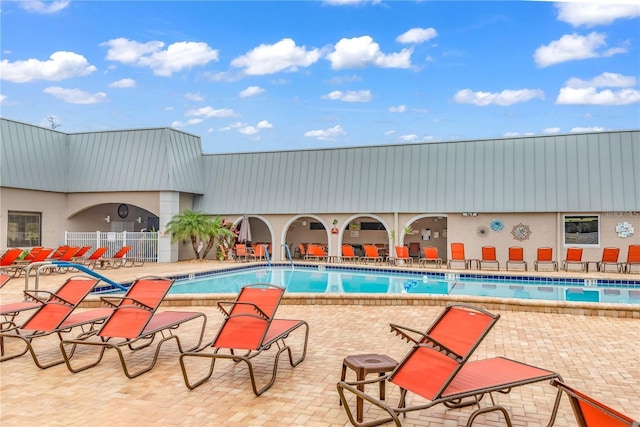 view of swimming pool with a patio area