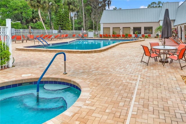 view of swimming pool with a patio