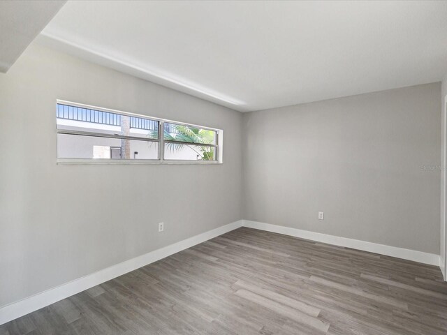 empty room featuring wood-type flooring