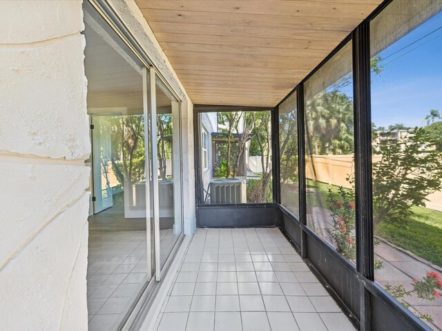 unfurnished sunroom featuring wooden ceiling