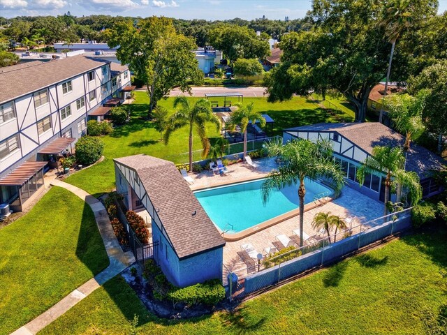 view of swimming pool with a patio and a yard