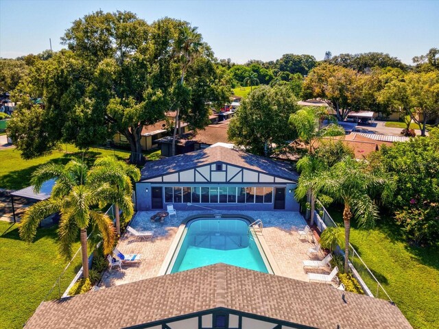 view of swimming pool featuring a lawn and a patio area