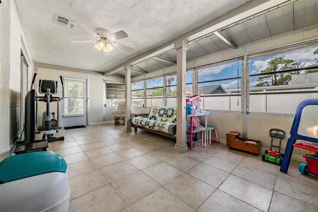 interior space featuring ceiling fan and a textured ceiling