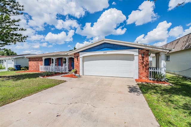 ranch-style home featuring a front lawn, covered porch, and a garage