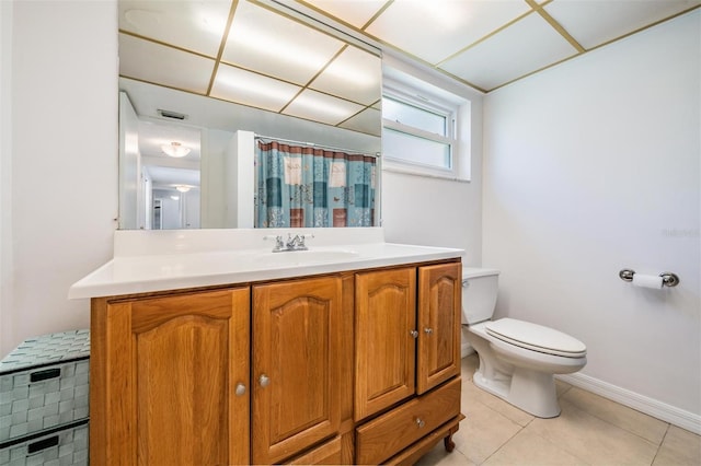 bathroom featuring tile patterned floors, vanity, a shower with shower curtain, and toilet