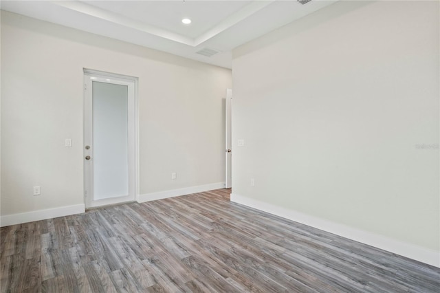 spare room featuring hardwood / wood-style floors