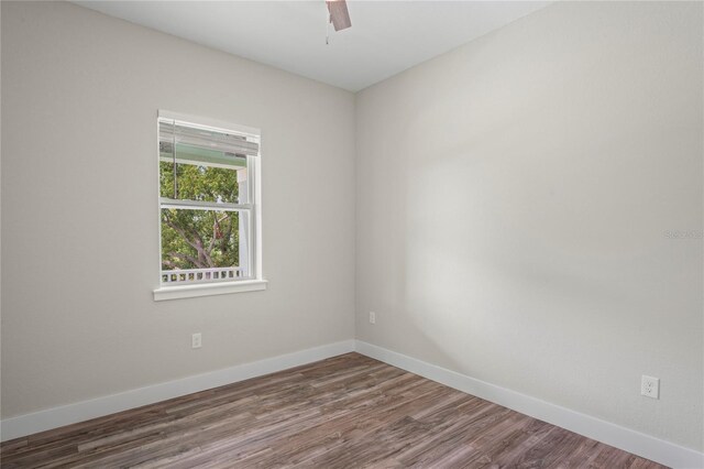 empty room featuring hardwood / wood-style floors and ceiling fan