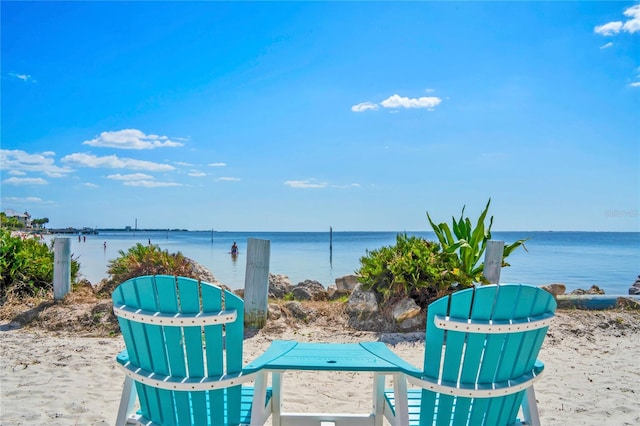 view of patio with a view of the beach and a water view