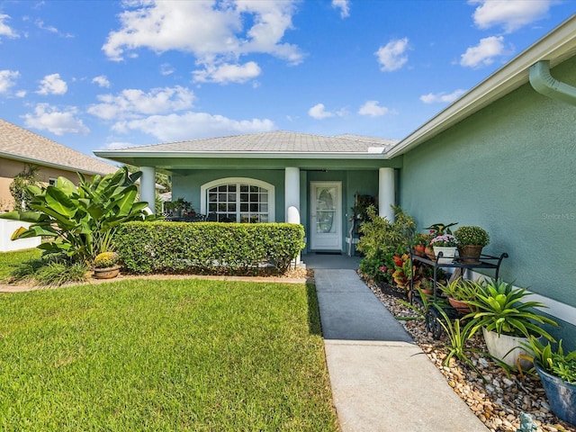 entrance to property with a yard