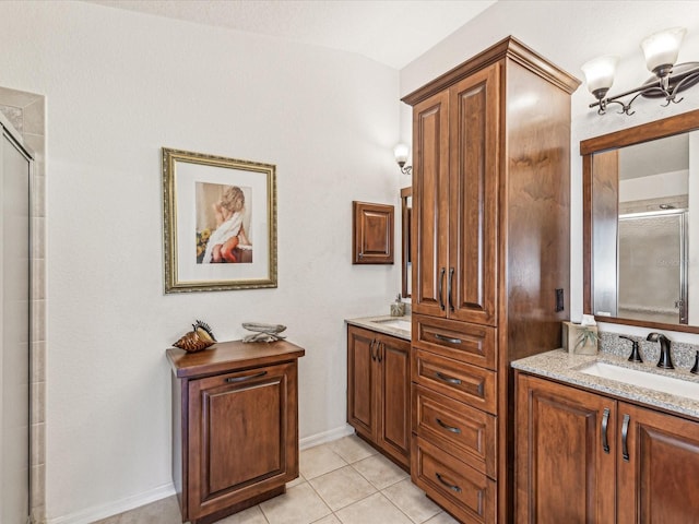 bathroom with tile patterned flooring, vanity, and an enclosed shower