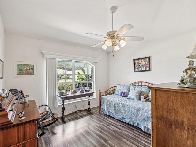 bedroom with dark wood-type flooring and ceiling fan