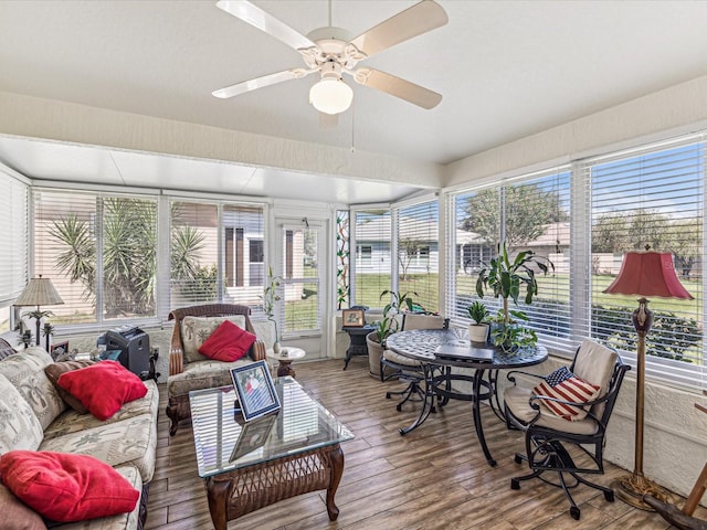 sunroom / solarium with a healthy amount of sunlight and ceiling fan