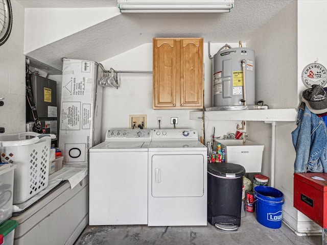 washroom with washing machine and dryer, electric water heater, a textured ceiling, cabinets, and sink