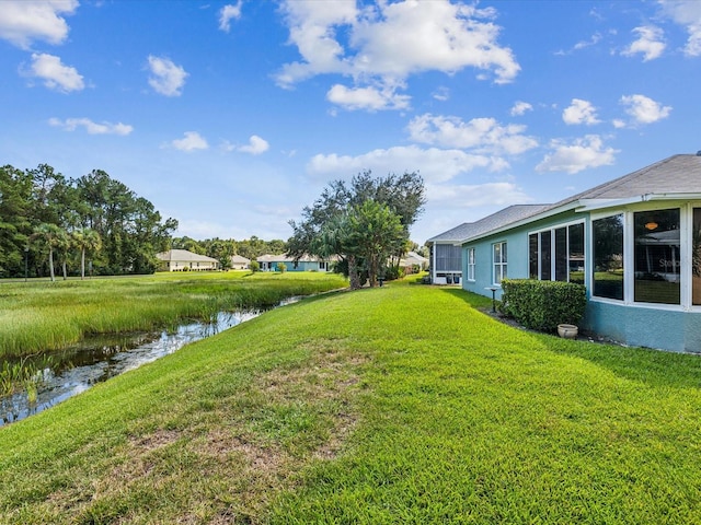 view of yard with a water view