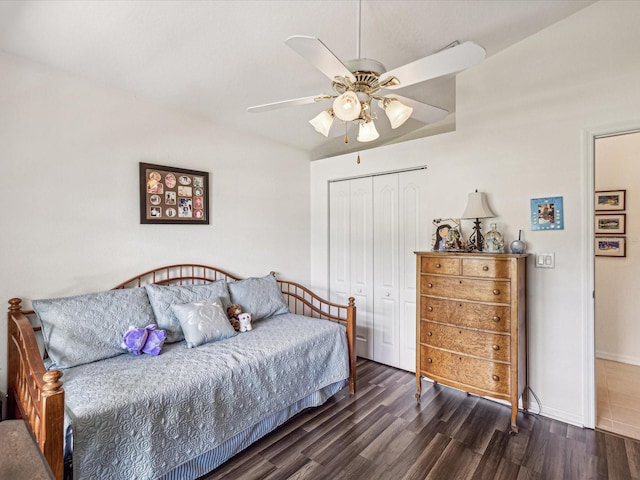 bedroom with ceiling fan, a closet, and dark hardwood / wood-style flooring