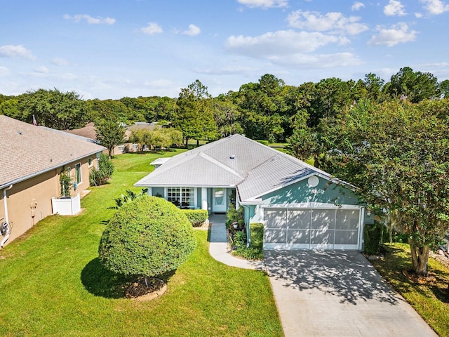 exterior space with a garage and a front lawn