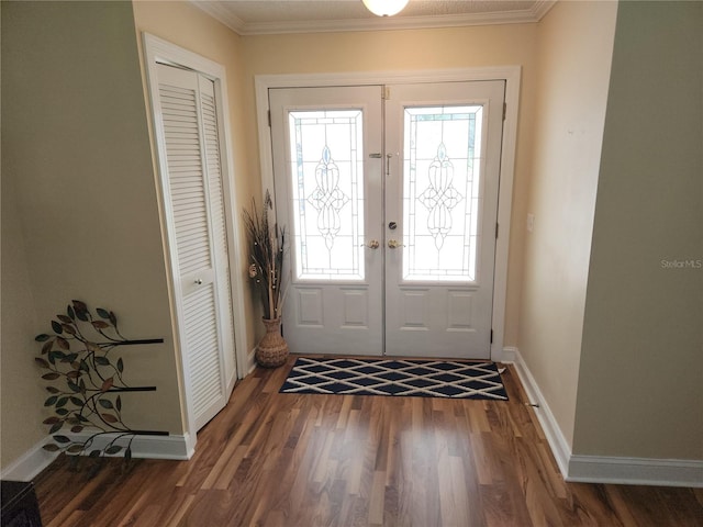 doorway to outside with french doors, dark hardwood / wood-style floors, and crown molding