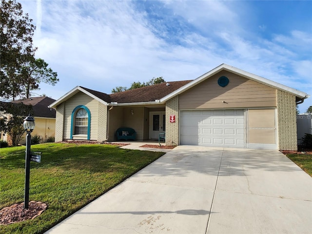 ranch-style house with a garage and a front yard