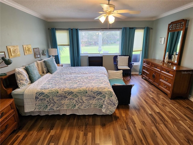 bedroom with ornamental molding, ceiling fan, dark hardwood / wood-style floors, and a textured ceiling