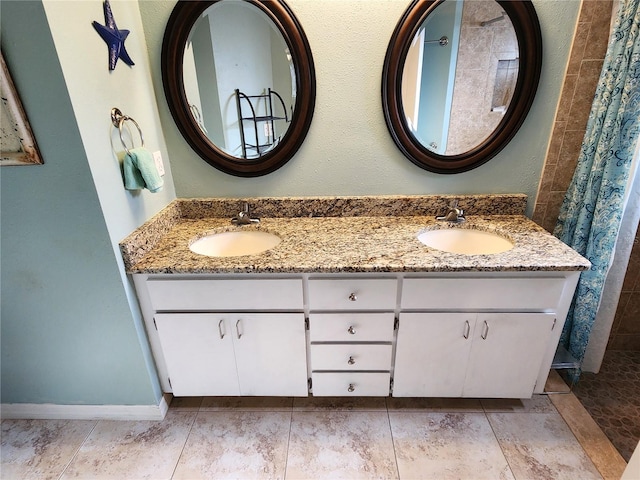 bathroom featuring vanity and a shower with shower curtain