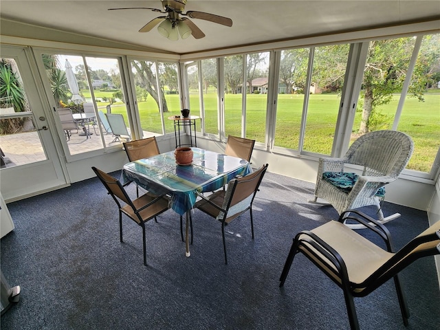 sunroom / solarium featuring ceiling fan and a wealth of natural light