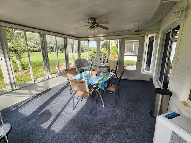 sunroom featuring ceiling fan and lofted ceiling