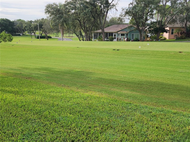 view of home's community featuring a lawn