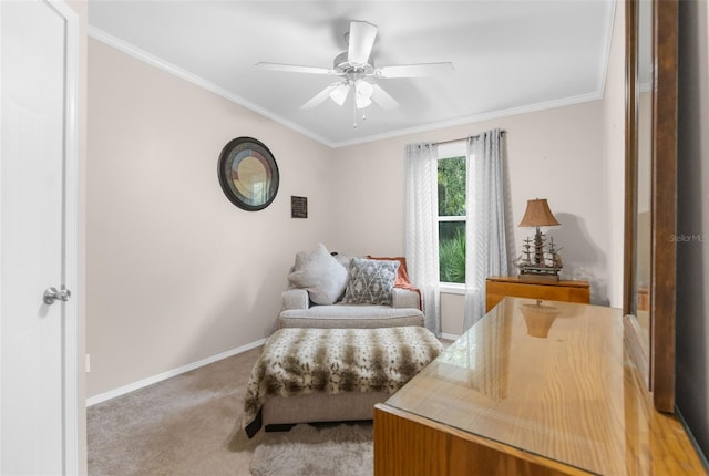 carpeted bedroom featuring crown molding and ceiling fan