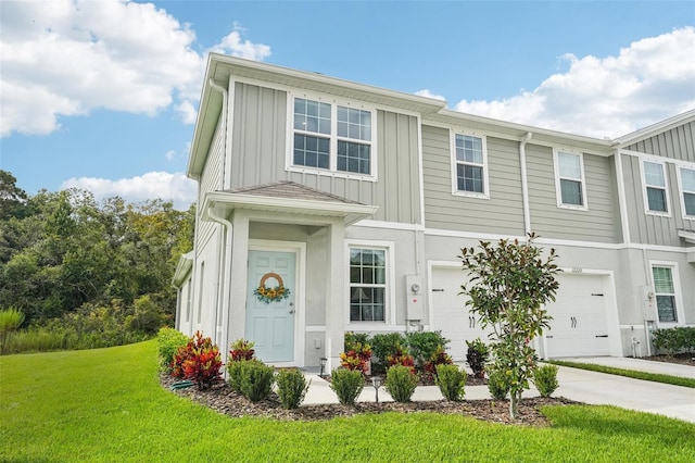 view of front facade with a garage and a front lawn