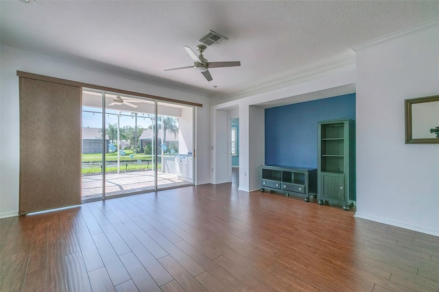 unfurnished living room featuring wood-type flooring, a textured ceiling, and ceiling fan