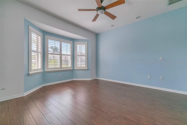 unfurnished room with ceiling fan and hardwood / wood-style flooring