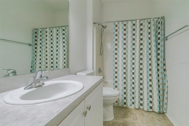 bathroom featuring walk in shower, vanity, and toilet