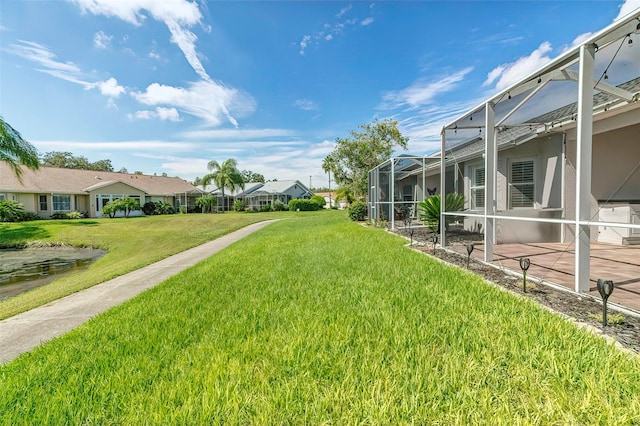 view of yard featuring glass enclosure