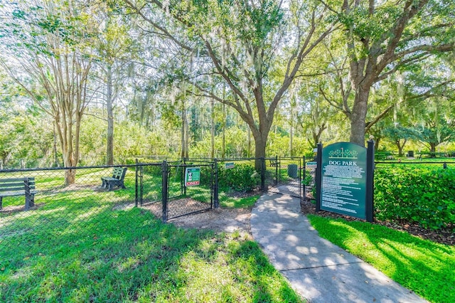 view of gate featuring a yard