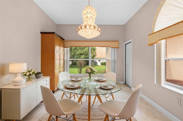 tiled dining space with a notable chandelier