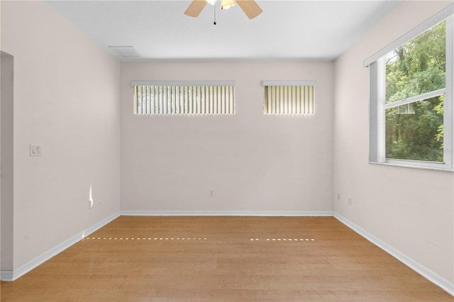 unfurnished room featuring light hardwood / wood-style floors and ceiling fan