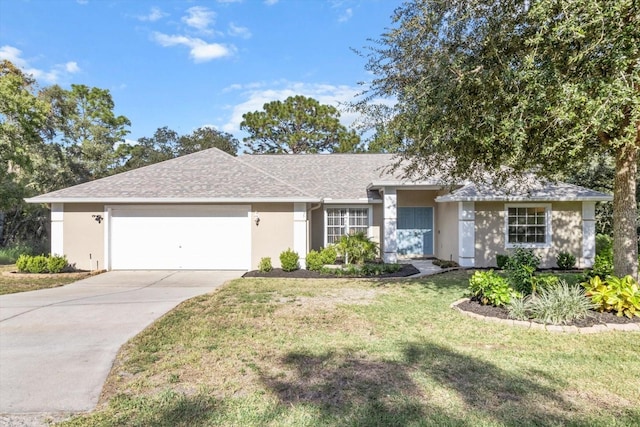 ranch-style home with a garage and a front yard