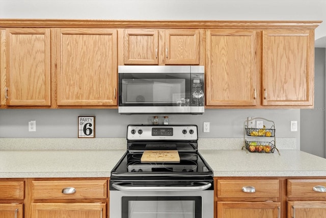 kitchen featuring light countertops and appliances with stainless steel finishes